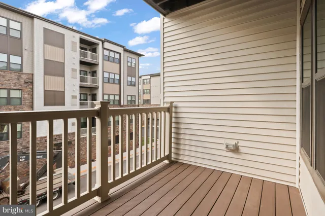 a view of a balcony with wooden floor