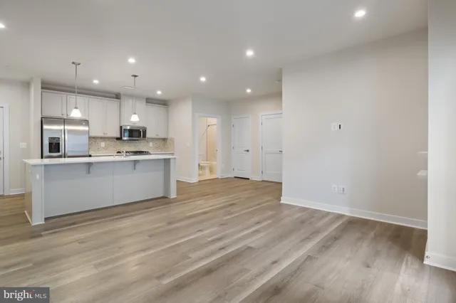 a view of kitchen with wooden floor