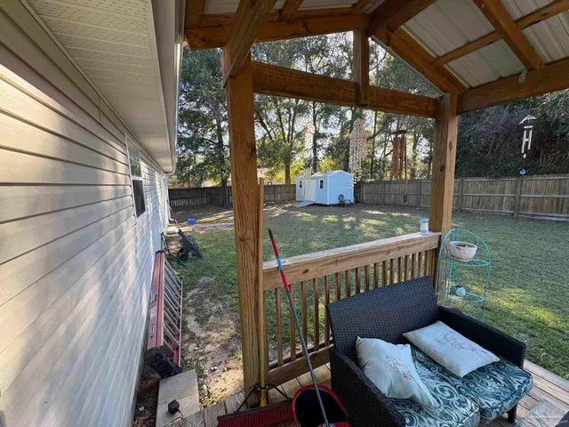 a view of a porch with furniture