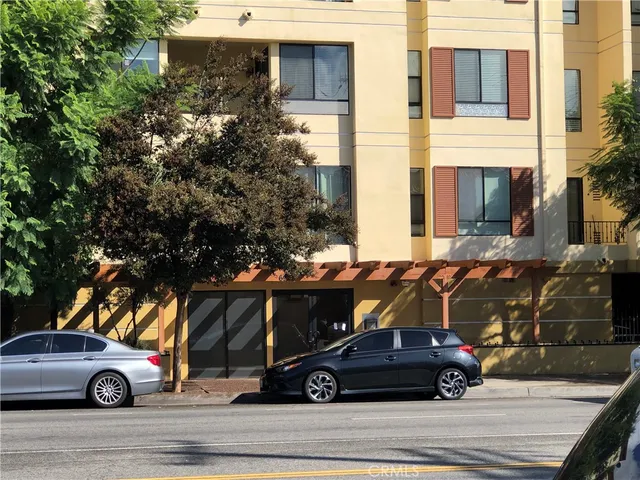 a view of a car parked on the side of a road