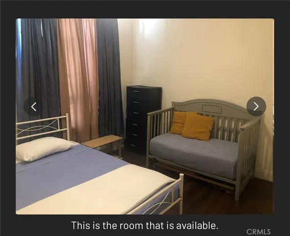 a bedroom with a bed and furniture