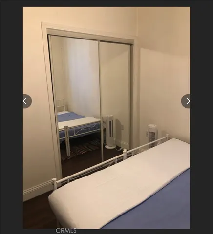 a room with a wooden floor and a fireplace