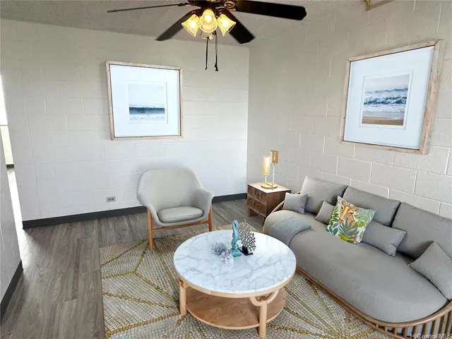 a living room with furniture and a lamp