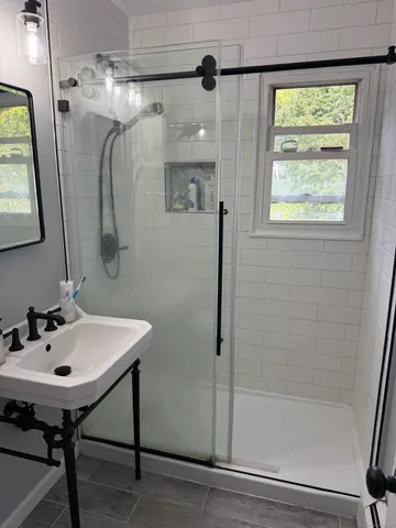 a bathroom with a sink and a mirror