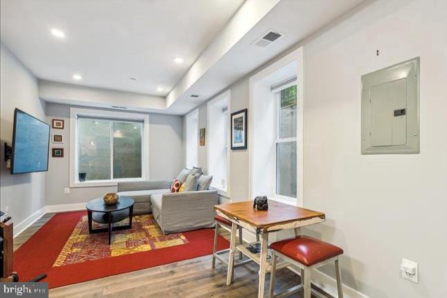 1340 Nicholson Street Northwest, Unit 2 Washington, DC 20011 - Photo 12 of 31 a living room with furniture a flat screen tv and a large window