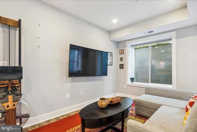 1340 Nicholson Street Northwest, Unit 2 Washington, DC 20011 - Photo 14 of 31 a living room with furniture and a window