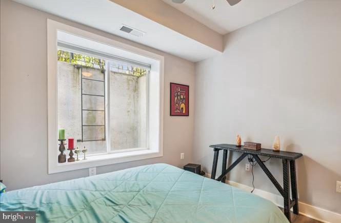 1340 Nicholson Street Northwest, Unit 2 Washington, DC 20011 - Photo 17 of 31 a bedroom with a bed and a window