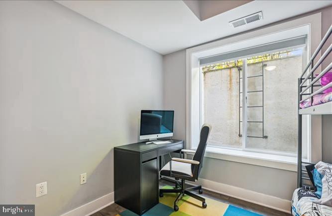 1340 Nicholson Street Northwest, Unit 2 Washington, DC 20011 - Photo 23 of 31 a view of a workspace with furniture and a window