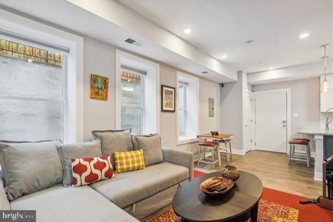 1340 Nicholson Street Northwest, Unit 2 Washington, DC 20011 - Photo 10 of 31 a living room with furniture and wooden floor