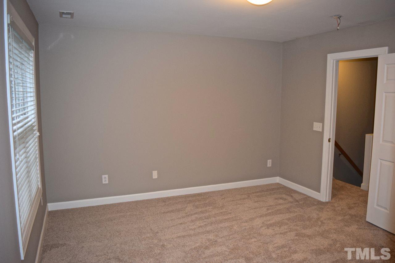 9106 Grassington Way Raleigh, NC 27615 - Photo 12 of 16 a view of an empty room