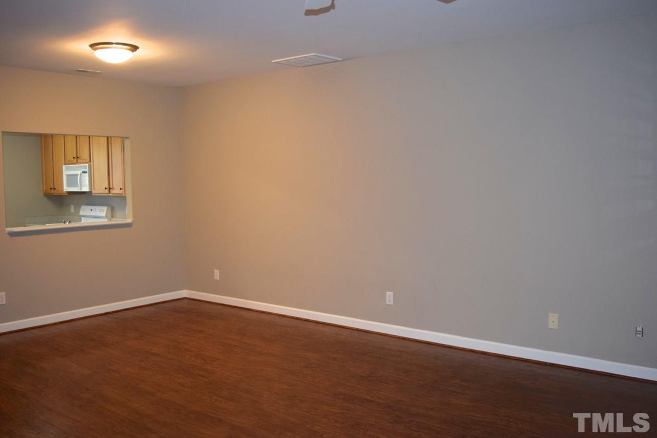 9106 Grassington Way Raleigh, NC 27615 - Photo 7 of 16 an empty room with a empty space and window