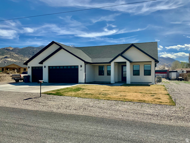 277 West 800 South Monroe, UT 84754 - Photo 2 of 46 Modern inspired farmhouse featuring a mountain view, driveway, a shingled roof, an attached garage, and stucco siding