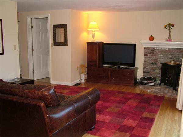 17 Argilla Road, Unit 5 Ipswich, MA 01938 - Photo 8 of 16 a living room with furniture and a flat screen tv