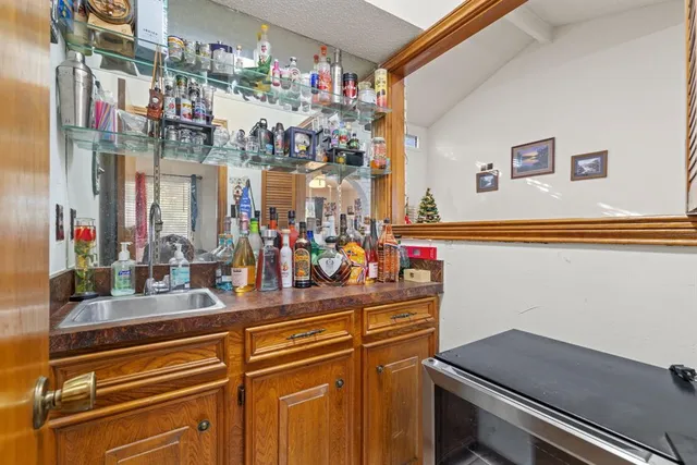 a kitchen counter top with stove and cabinets