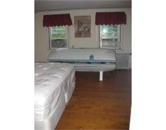 19 Main Street Little Compton, RI 02837 - Photo 15 of 25 a bathroom with a sink and a mirror