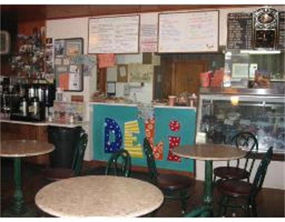 19 Main Street Little Compton, RI 02837 - Photo 19 of 25 a bathroom with a sink a dining table and chairs