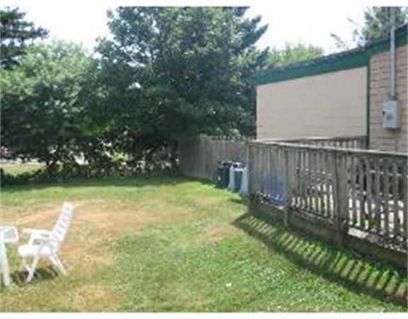 19 Main Street Little Compton, RI 02837 - Photo 6 of 25 a view of a backyard with a garden