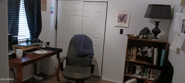 a bedroom with a bed and a closet