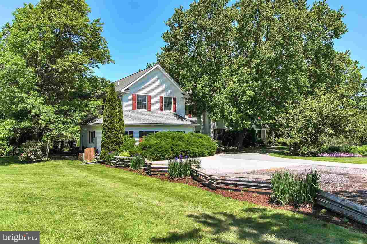 305 Crooked Creek Road Gettysburg, PA 17325 - Photo 2 of 36 a front view of a house with garden