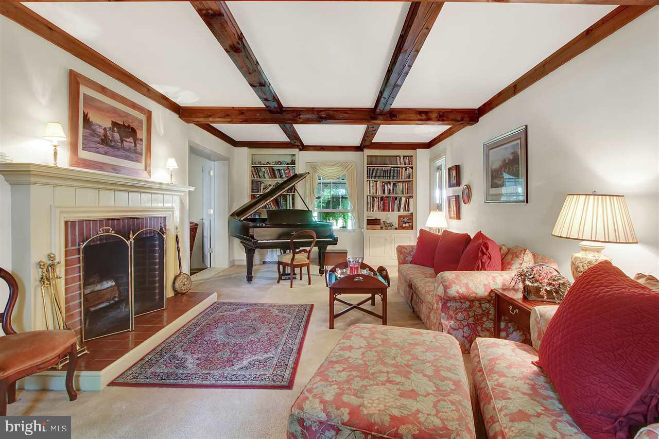 305 Crooked Creek Road Gettysburg, PA 17325 - Photo 11 of 36 a living room with furniture a fireplace and a table