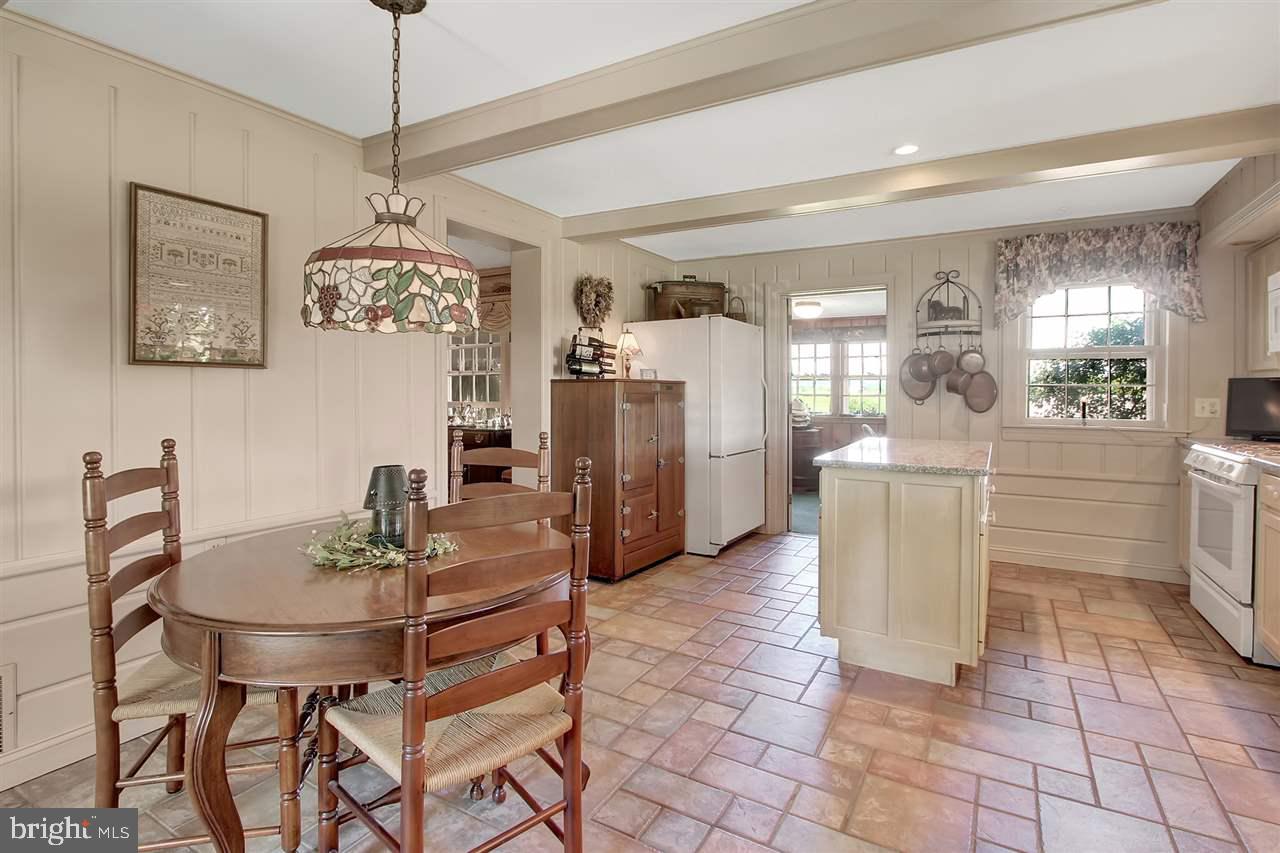 305 Crooked Creek Road Gettysburg, PA 17325 - Photo 15 of 36 a view of a dining room with furniture and a chandelier