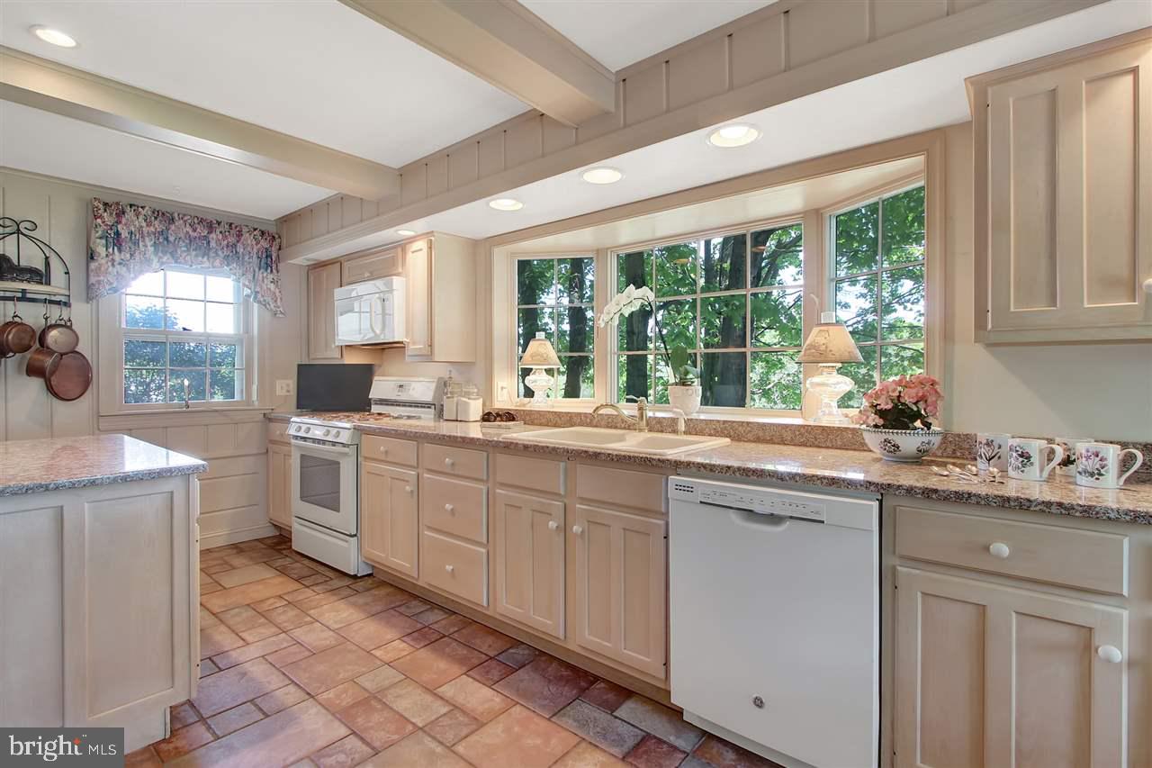 305 Crooked Creek Road Gettysburg, PA 17325 - Photo 16 of 36 a kitchen with sink cabinets and stove