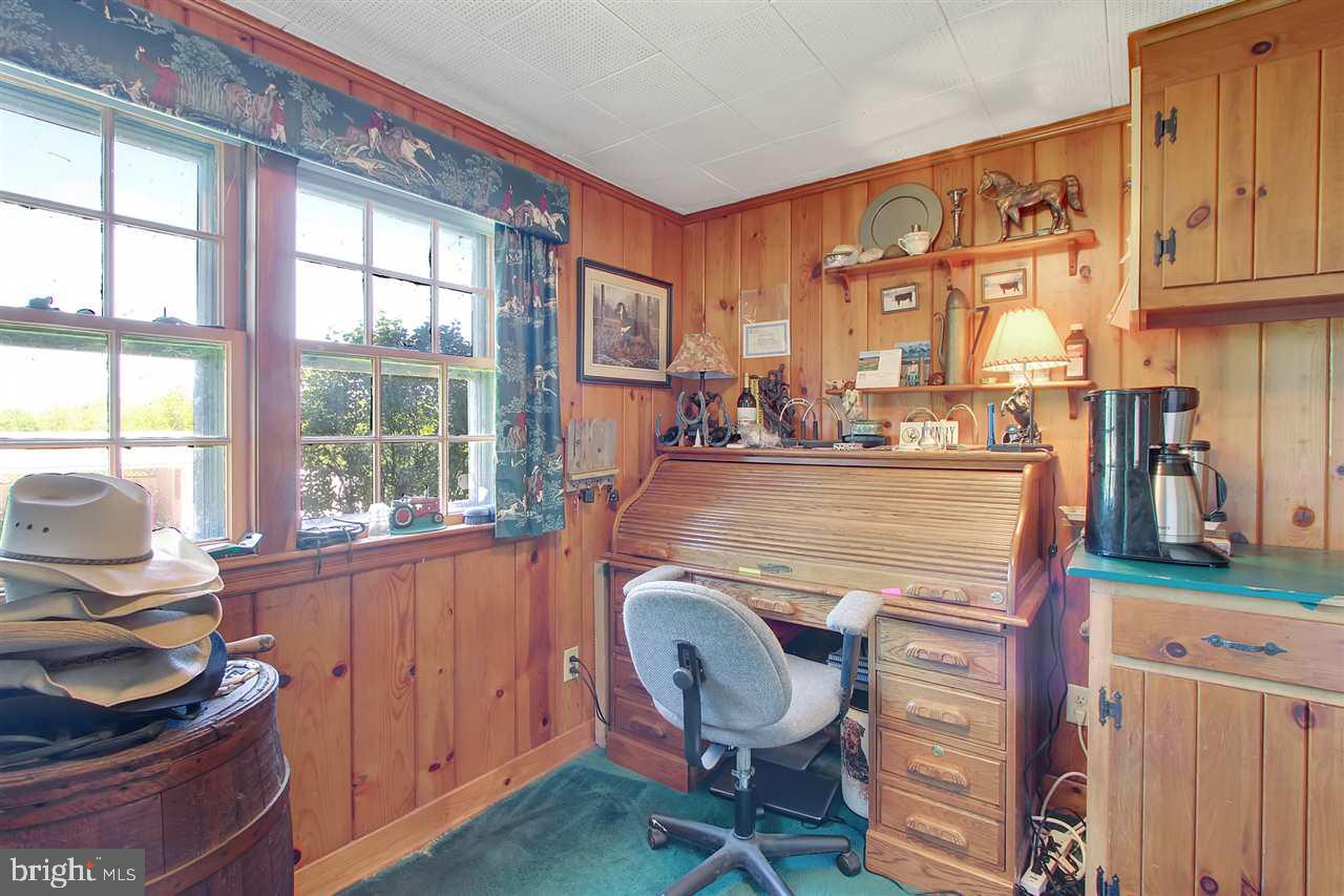 305 Crooked Creek Road Gettysburg, PA 17325 - Photo 17 of 36 a room with granite countertop furniture a rug and a window