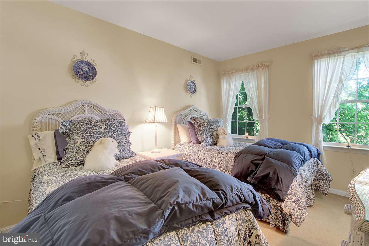 305 Crooked Creek Road Gettysburg, PA 17325 - Photo 22 of 36 a bedroom with two large bed and a large window