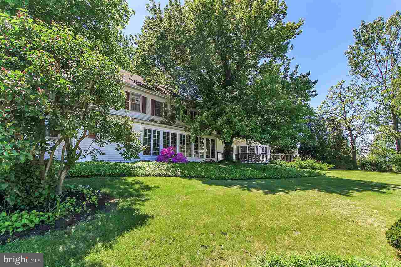305 Crooked Creek Road Gettysburg, PA 17325 - Photo 24 of 36 a view of a house next to a big yard and large trees
