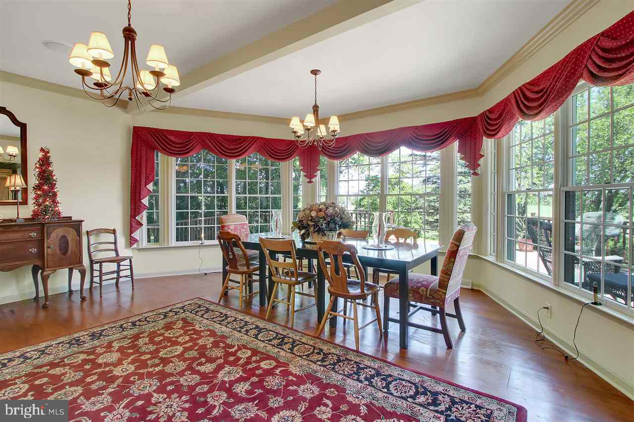 305 Crooked Creek Road Gettysburg, PA 17325 - Photo 6 of 36 a view of a dining room with furniture window and wooden floor