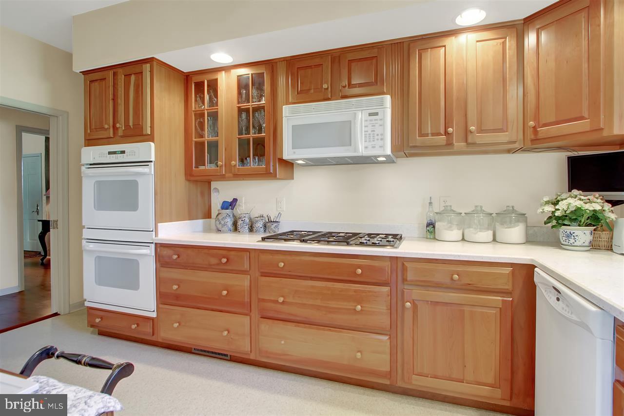 305 Crooked Creek Road Gettysburg, PA 17325 - Photo 7 of 36 a kitchen with granite countertop white cabinets and sink