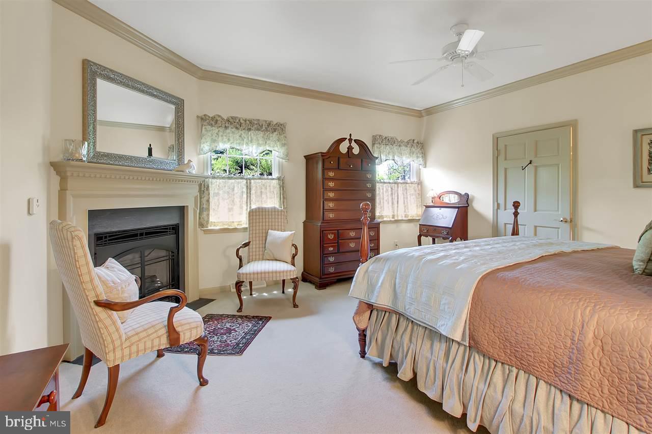 305 Crooked Creek Road Gettysburg, PA 17325 - Photo 10 of 36 a bed room with a bed and a fireplace