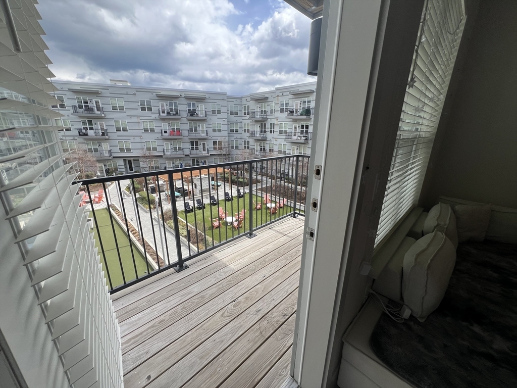 255 Vale Street, Unit 5218 Chelsea, MA 02150 - Photo 8 of 9 a view of balcony with furniture