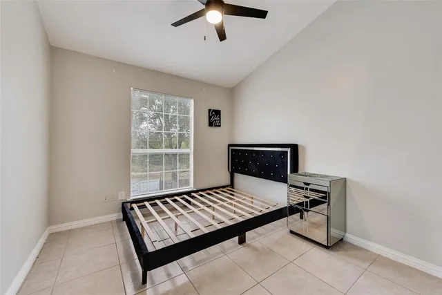 a living room with a bed furniture and a window