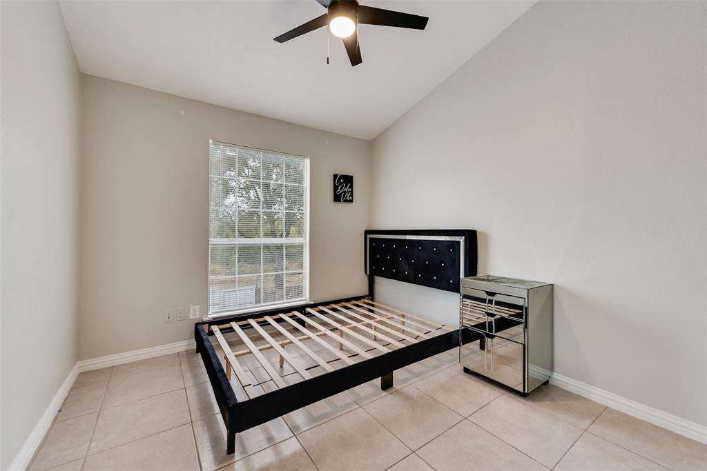 2629 Coldstream Drive Fort Worth, TX 76123 - Photo 17 of 24 a living room with a bed furniture and a window