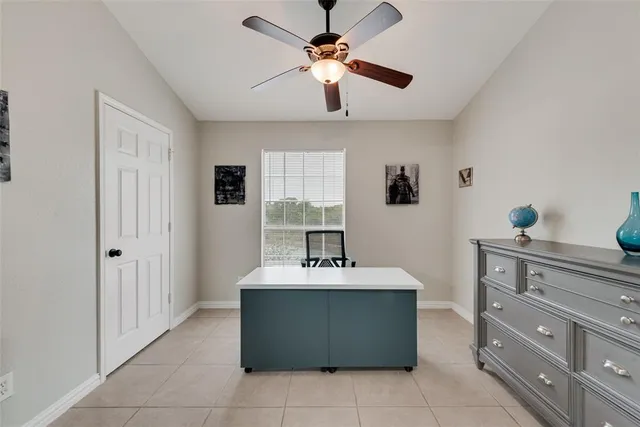 a kitchen with a stove top oven and cabinets