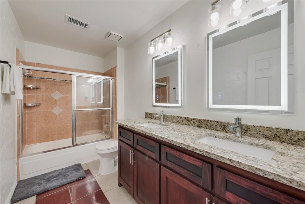 2629 Coldstream Drive Fort Worth, TX 76123 - Photo 19 of 24 a bathroom with a granite countertop sink mirror and double