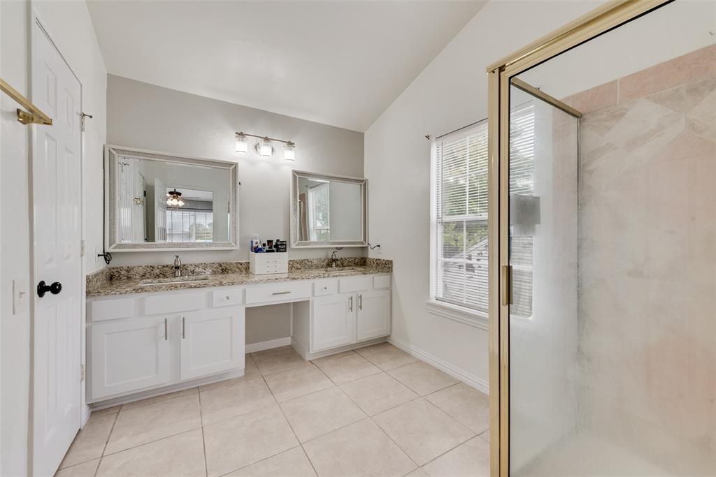 2629 Coldstream Drive Fort Worth, TX 76123 - Photo 22 of 24 a bathroom with a granite countertop sink a mirror and a bathtub