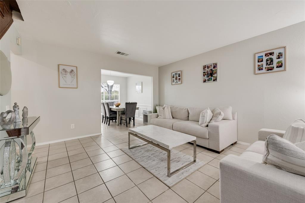 2629 Coldstream Drive Fort Worth, TX 76123 - Photo 3 of 24 a living room with furniture and a table