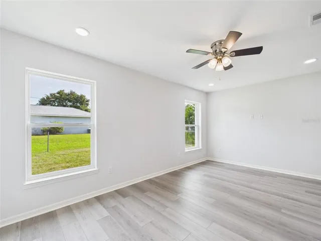 a view of a bedroom from a hallway