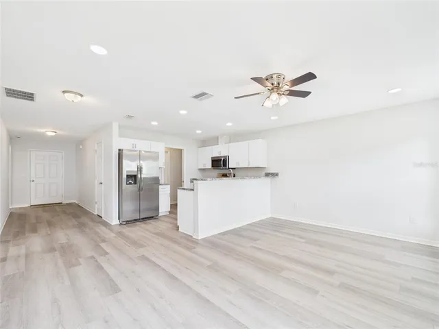 a view of kitchen with wooden floor and window