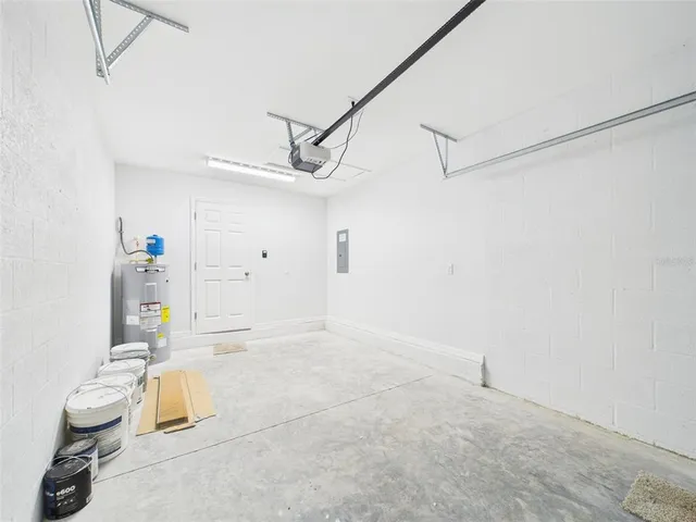 a view of a house with a yard and garage