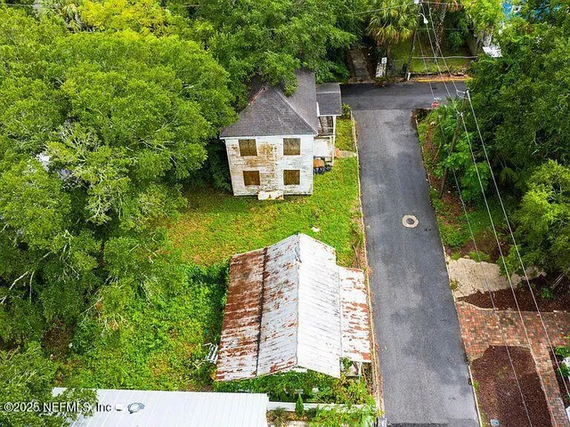 an aerial view of a house with a garden