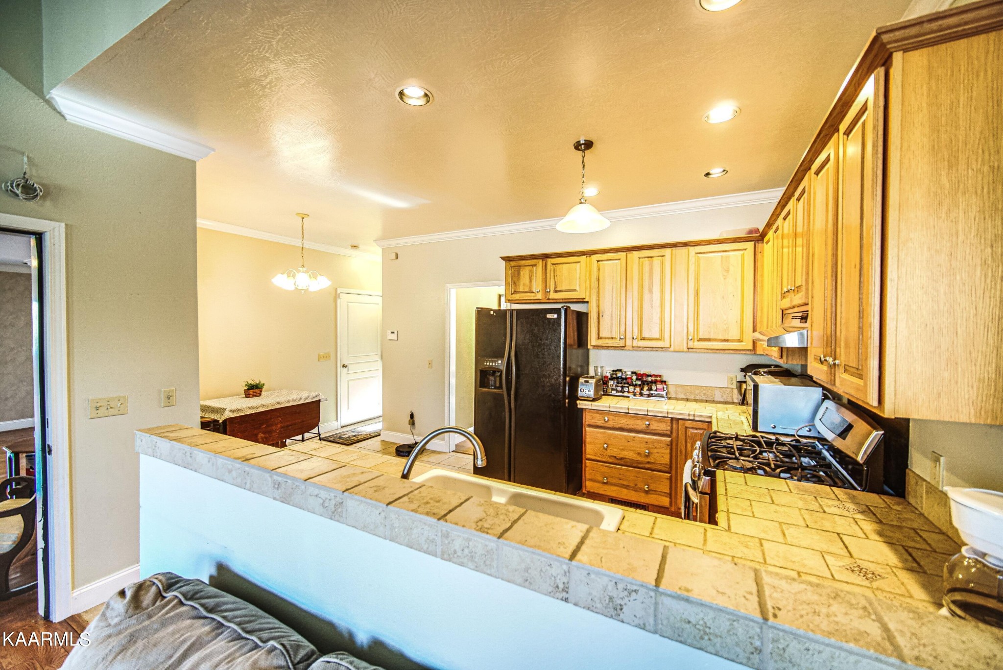 469 E Cove Monterey, TN 38574 - Photo 11 of 34 a kitchen with stainless steel appliances granite countertop a sink and cabinets