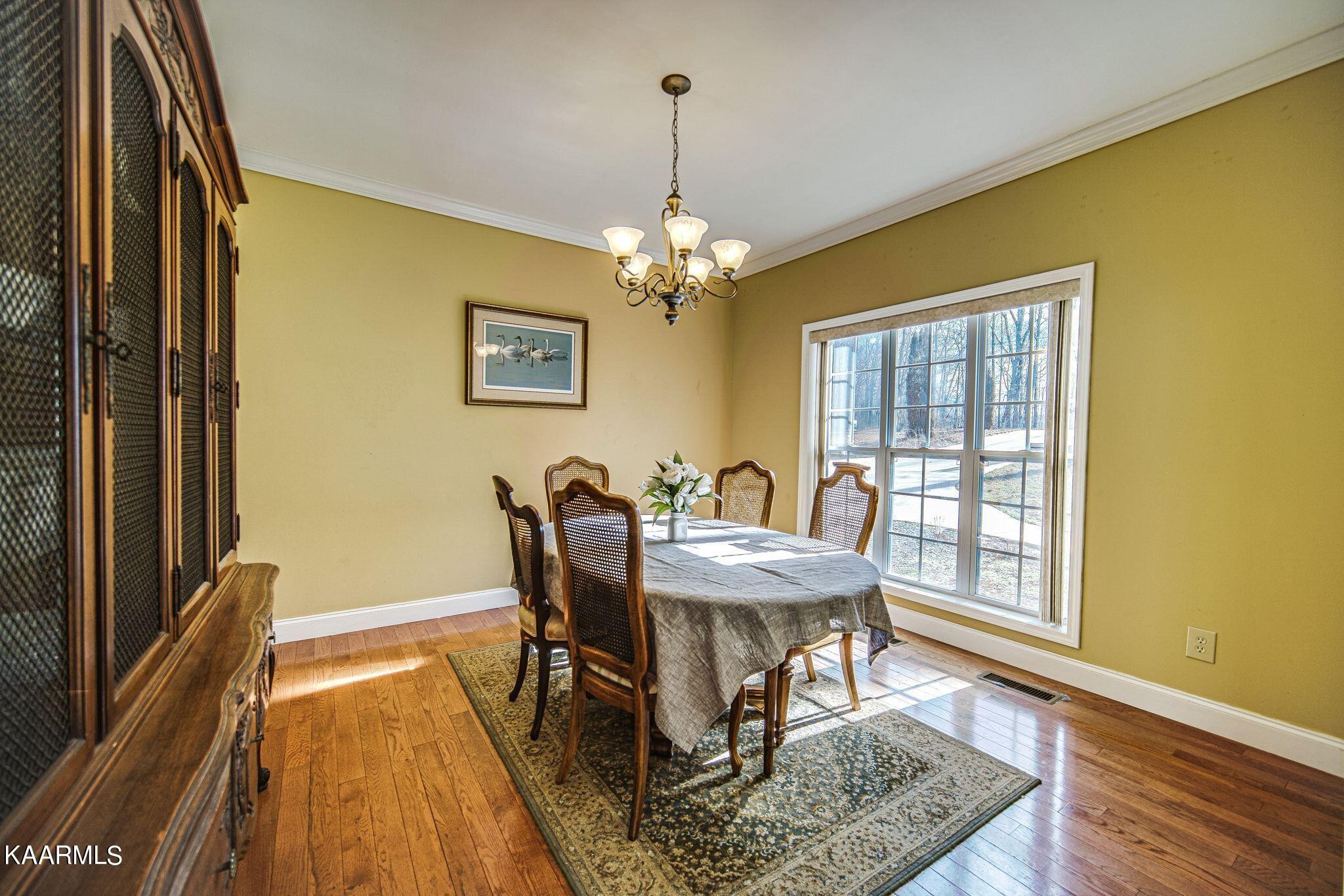 469 E Cove Monterey, TN 38574 - Photo 12 of 34 a view of a dining room with furniture and wooden floor