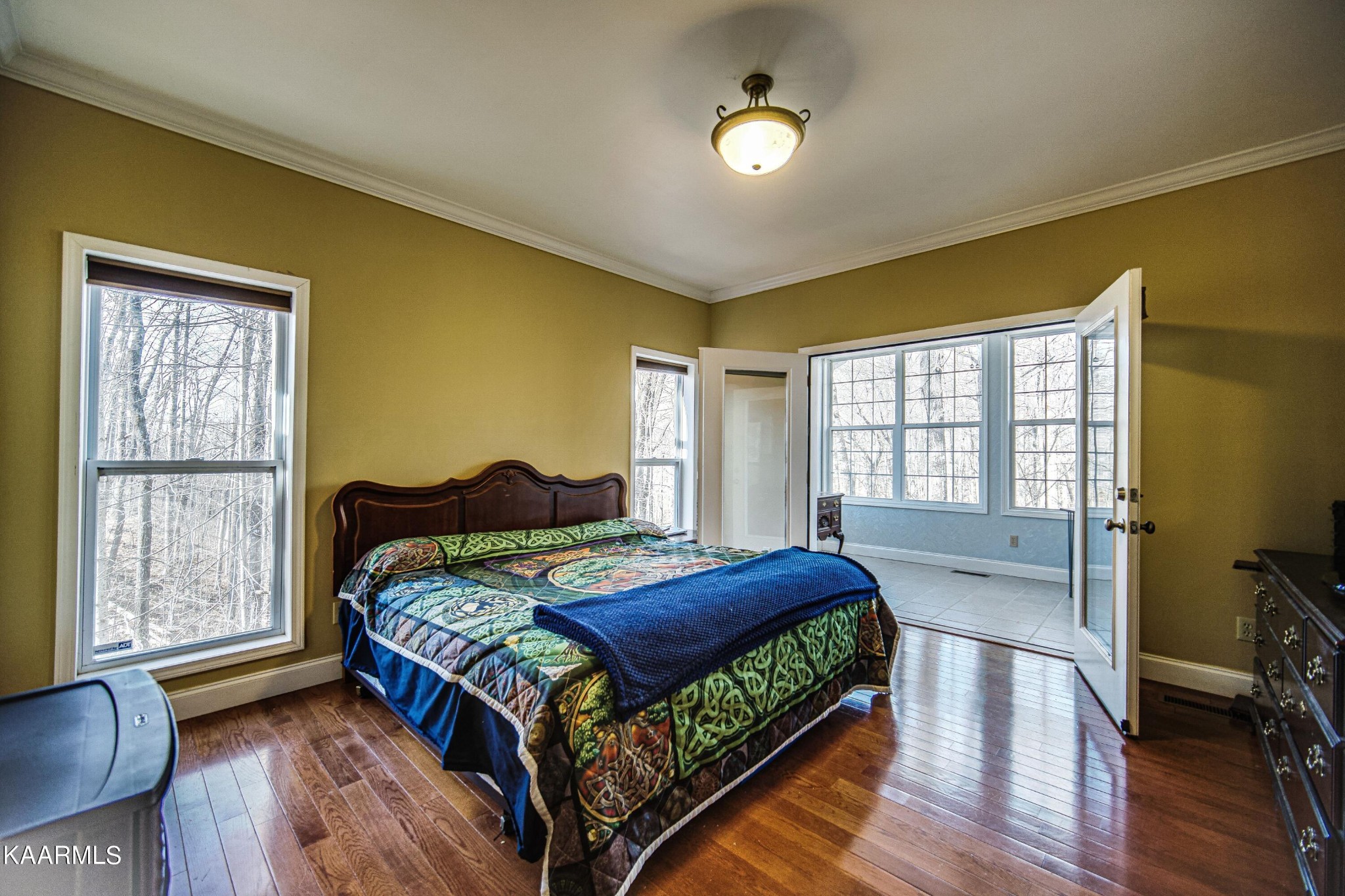 469 E Cove Monterey, TN 38574 - Photo 16 of 34 a bedroom with a bed and wooden floor