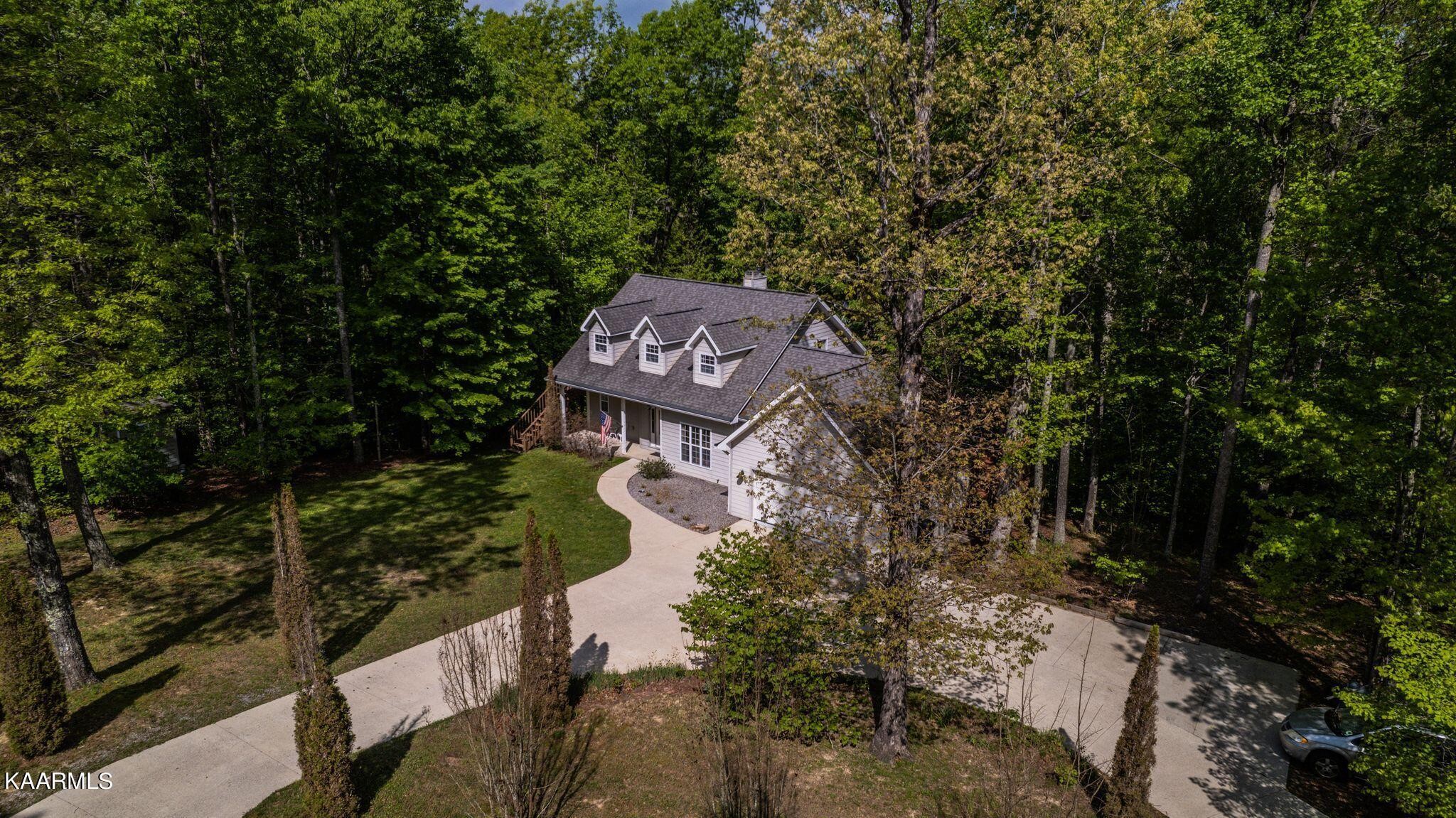 469 E Cove Monterey, TN 38574 - Photo 3 of 34 a sign board with a house in the background