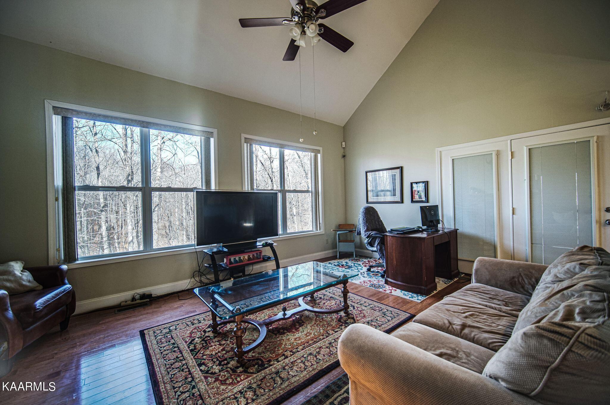 469 E Cove Monterey, TN 38574 - Photo 8 of 34 a living room with furniture a window and a flat screen tv