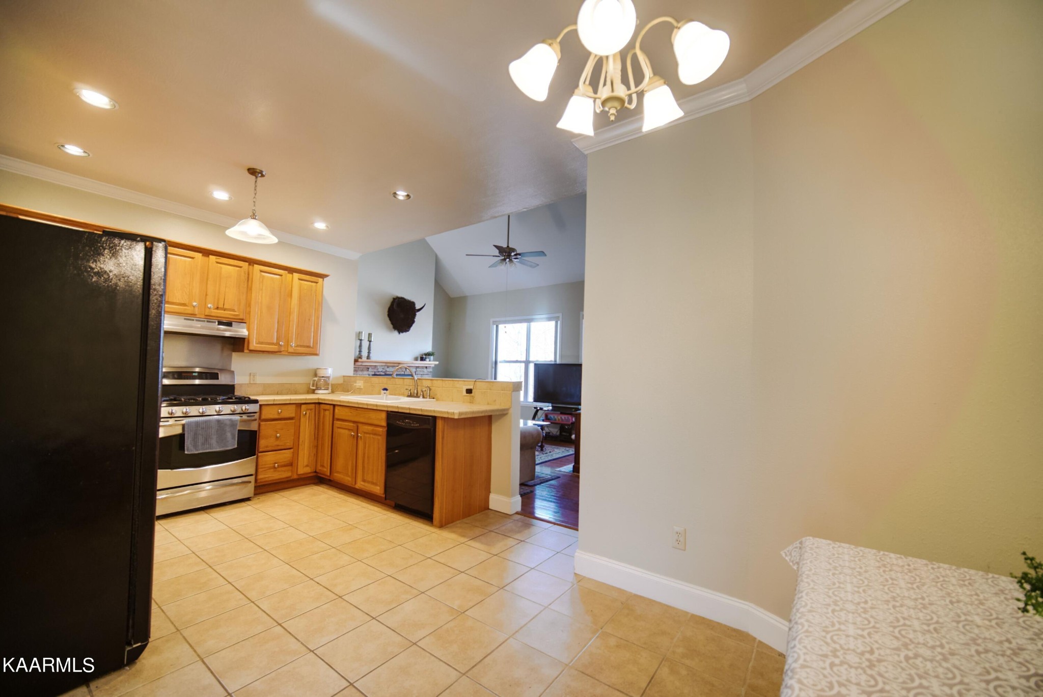 469 E Cove Monterey, TN 38574 - Photo 10 of 34 a large kitchen with a sink stainless steel appliances and counter space