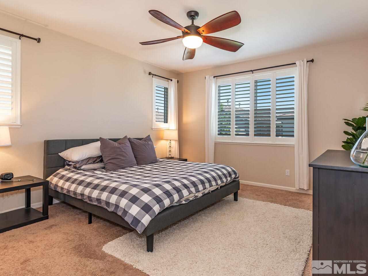1985 Hope Valley Drive Reno, NV 89521 - Photo 11 of 19 a bedroom with a bed and a window